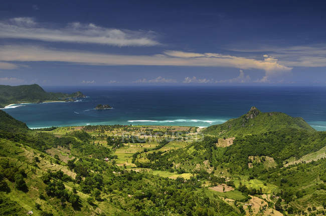 Indonesia, Serangan, beautiful landscape with green hills and sea — Stock Photo