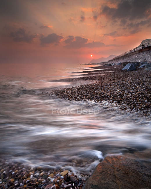 West Bay at Sunset on a stormy day, Dorset, UK — Stock Photo