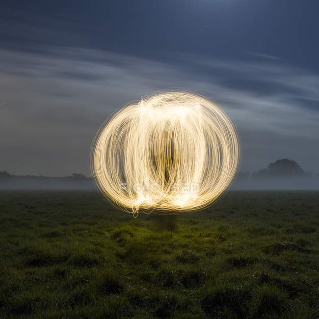 United Kingdom, Berkshire, Sphere made of light in meadow — Stock Photo