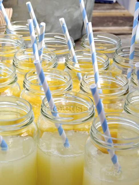 Close-up of lemonade jars on lemonade stand — Stock Photo