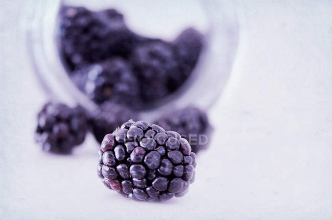 Close-up view of blackberries dropped from jar — Stock Photo
