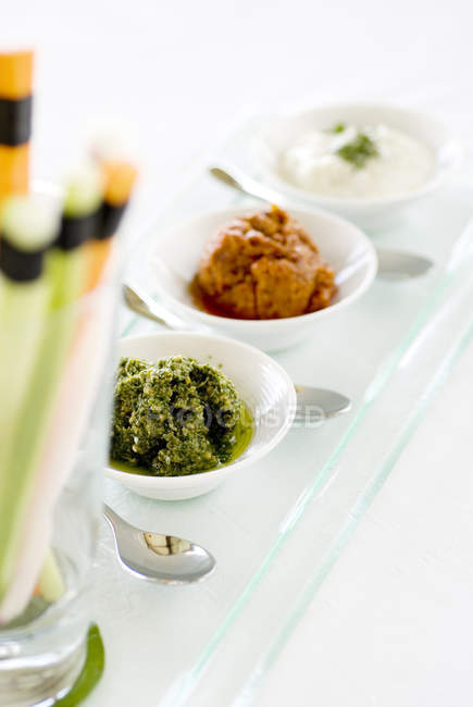 Three types of condiments in bowls, closeup — Stock Photo