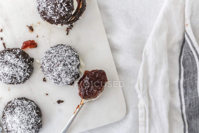 Preparing Lamington biscuits with coconut, top view — Stock Photo