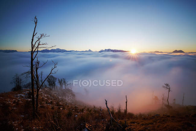 Scenic view of sunset over the clouds, Alps, Salzburg, Austria — Stock Photo