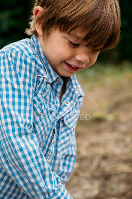 Portrait of a smiling boy on nature — Stock Photo