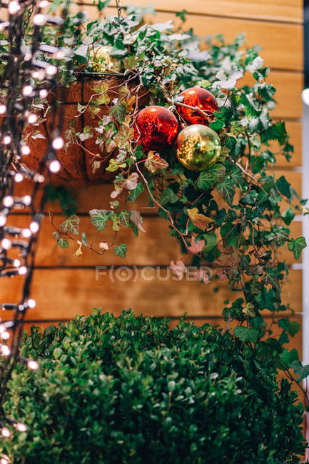 Christmas street decoration with fairy lights and baubles — Stock Photo