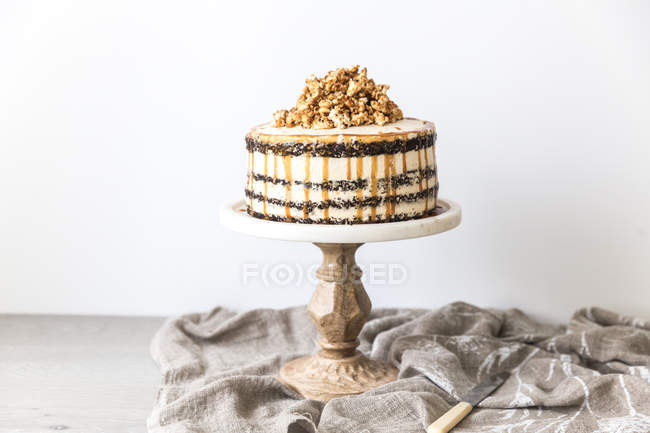 Chocolate layered sponge cake with caramel buttercream — Stock Photo