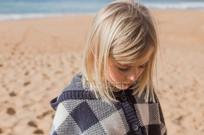 Close-up portrait of a girl standing on beach — Stock Photo
