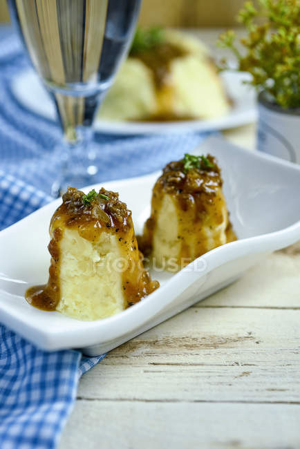 Mash Potato towers with sauce on white plate — Stock Photo