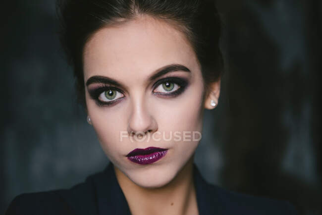 Portrait of stylish young woman in suit — Stock Photo