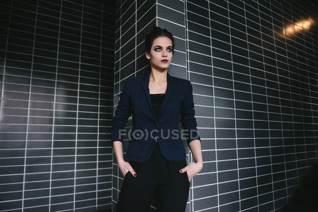 Portrait of stylish young woman in suit — Stock Photo
