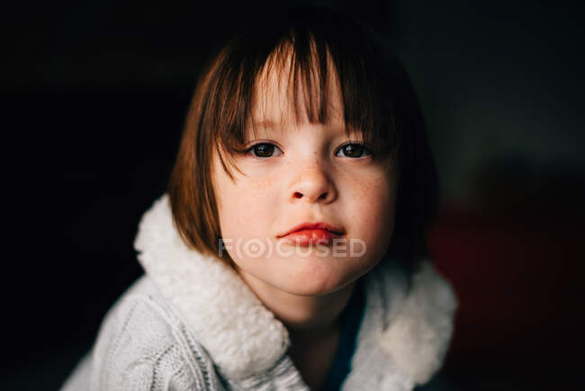 Portrait of beautiful little girl on black background — Stock Photo