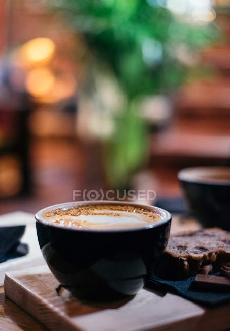 Coffee and chocolate in cafe, selective focus — Stock Photo