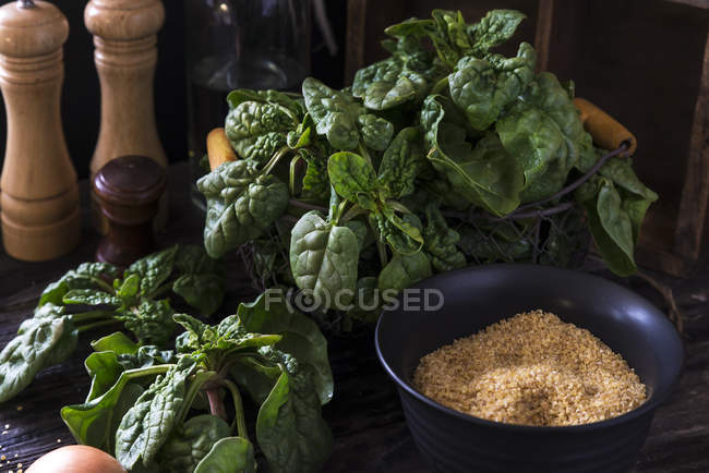 Spinach, egg, sugar, salt and pepper — Stock Photo