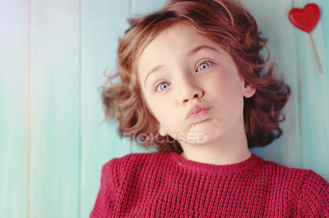Top view of adorable Boy blowing kisses — Stock Photo