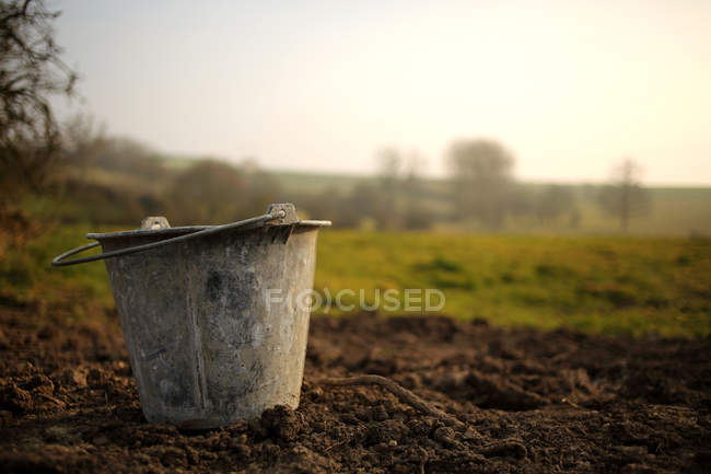 Scenic view of Metal bucket in the garden — Stock Photo