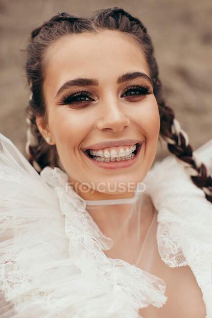 Portrait of a smiling woman with dental braces — Stock Photo