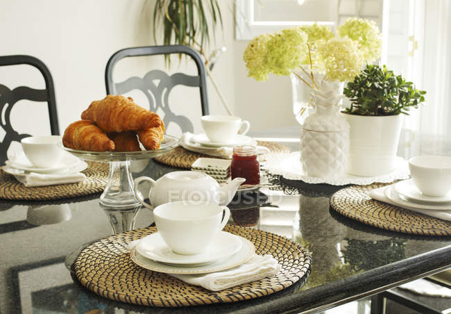Croissants on a served Breakfast table at home — Stock Photo