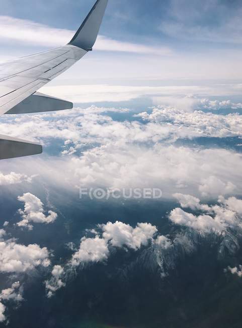 Scenic view of airplane wing in the sky — Stock Photo