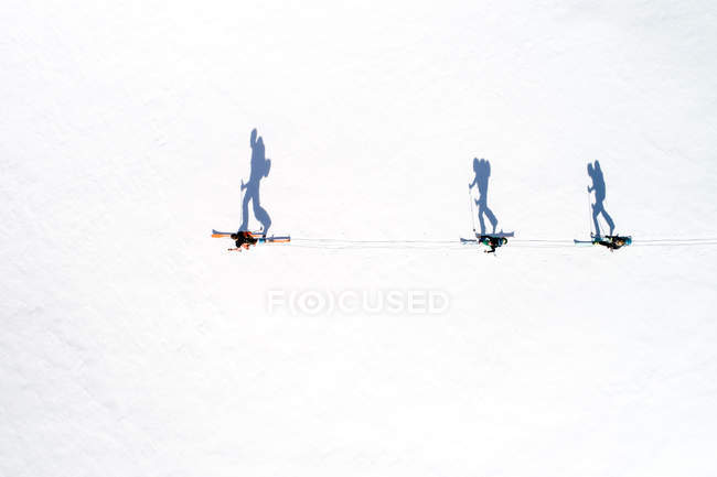 Aerial view of skiers and their shadows, Bad Gastein, Salzburg, Austria — Stock Photo