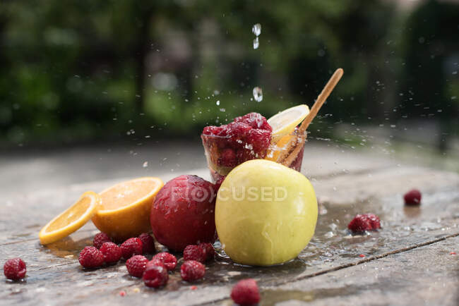 Ice cubes, fruits and vegetables on the beach — Stock Photo