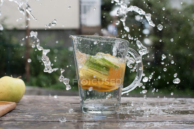 Fresh water with ice cubes on the table — Stock Photo