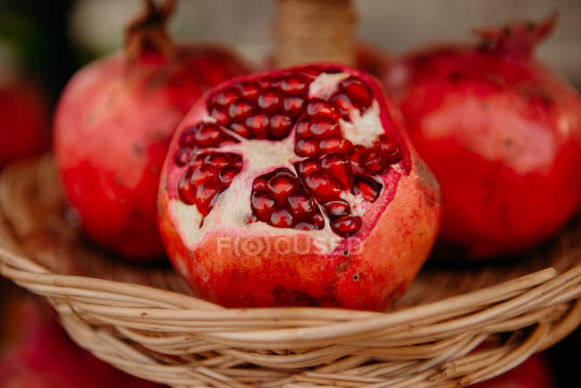 Closeup view of fresh Pomegranates in a basket — Stock Photo