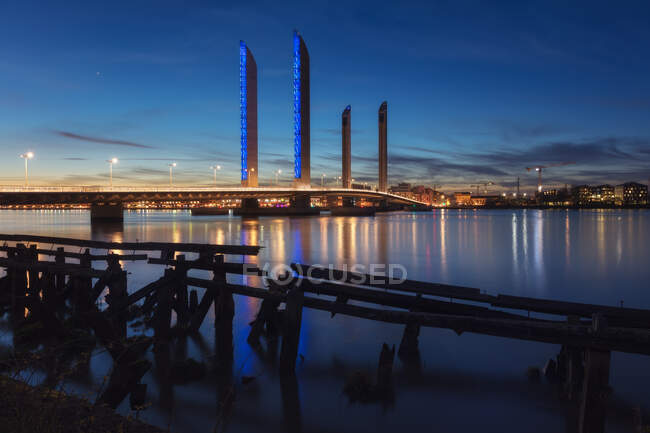 Night view of city and harbor in evening lights — Stock Photo