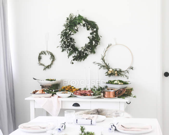 Christmas dinner on a sideboard in a dining room — Stock Photo