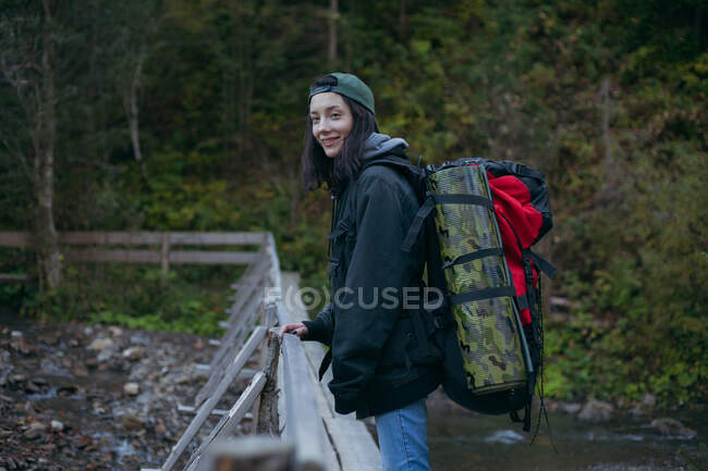 Female hiker standing on a bridge, Ukraine — Stock Photo