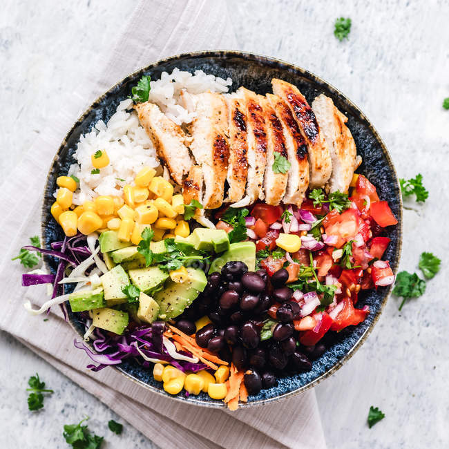 Top view of Grilled chicken and rice salad bowl — Stock Photo