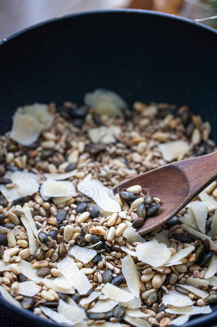 Roasted nuts and seeds with parmesan cheese — Stock Photo