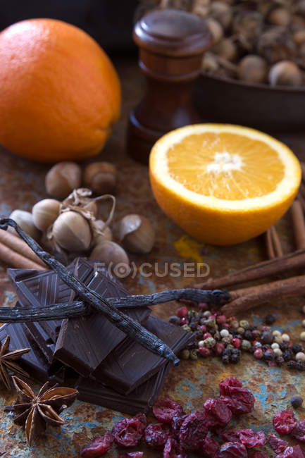 Chocolate, orange, hazelnuts and spices — Stock Photo