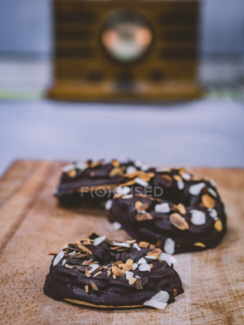 Chocolate cookies with nuts on wooden board — Stock Photo