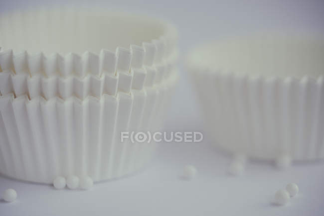 Visão de close-up de cupcake cases em fundo desfocado — Fotografia de Stock