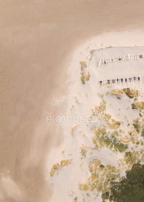 Aerial view of sandy beach with sunbeds — Stock Photo