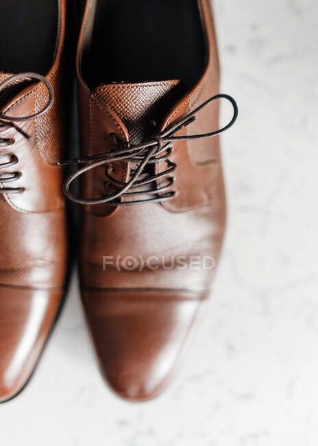 Stylish leather shoes on light background — Stock Photo