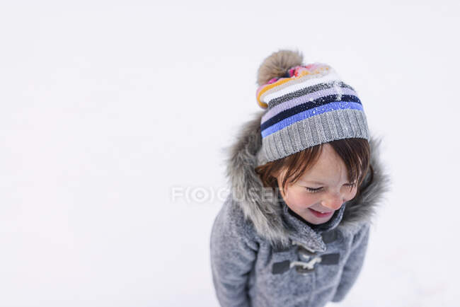 Portrait of young girl outside in the snow — Stock Photo