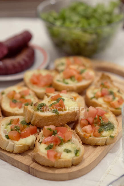 Tasty Bruschetta with tomatoes closeup view — Stock Photo