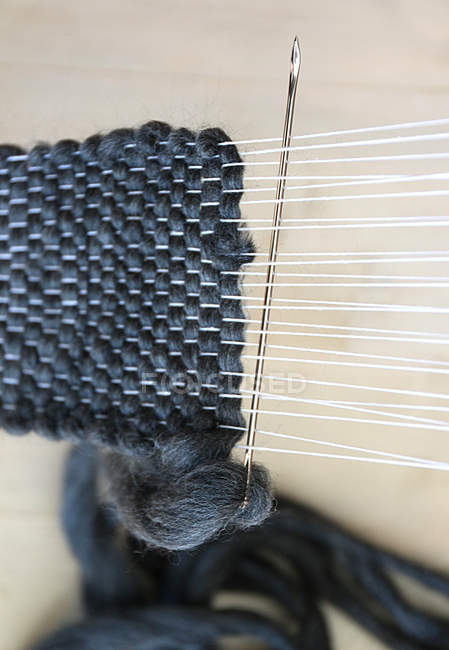 Closeup view of the handmade scarf knitting — Stock Photo