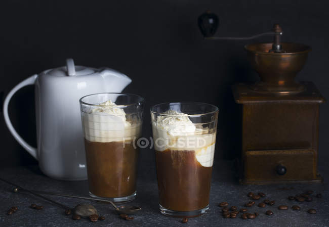 Iced coffee in a tall glass with ice cream — Stock Photo
