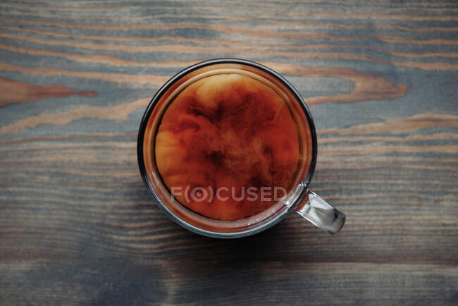 Overhead view of a cup of milky tea — Stock Photo