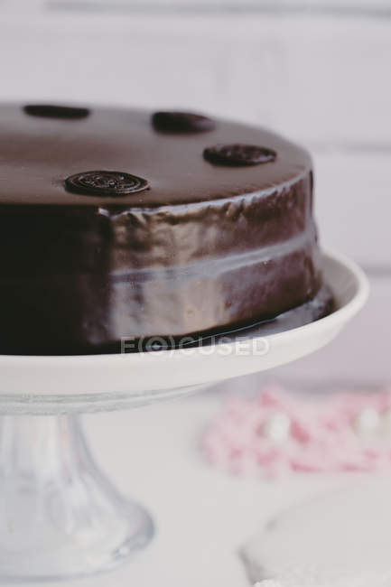 Sachertorte on a cake stand, closeup view — Stock Photo