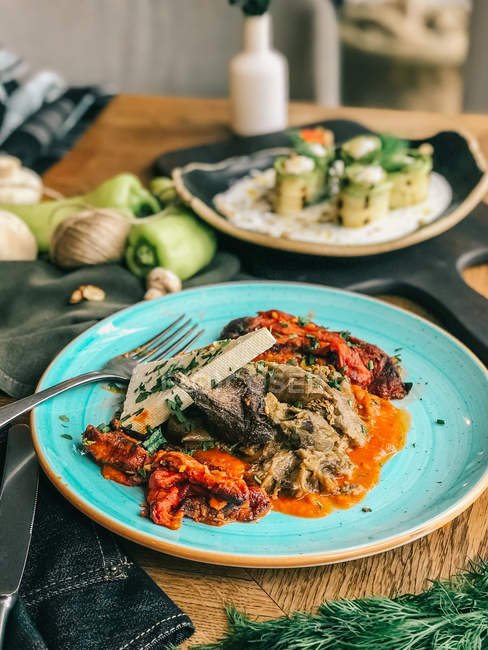 Roasted aubergine with tomato and cheese — Stock Photo