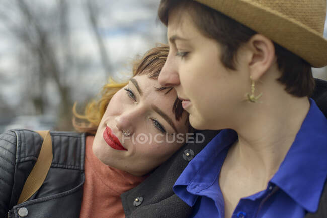 Portrait of a woman leaning on her friend's shoulder — Stock Photo