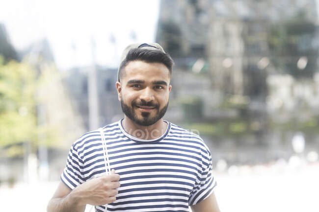 Portrait of a smiling man standing in the city — Stock Photo
