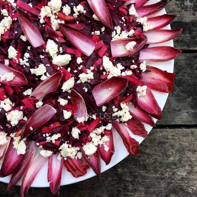 Red endive salad with feta cheese, top view — Stock Photo