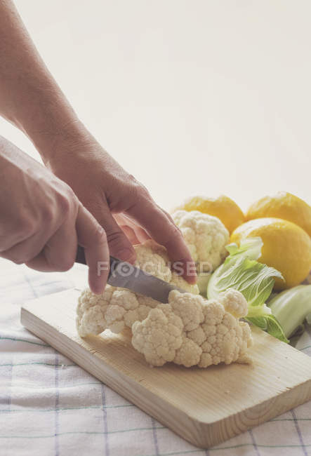 Close-up view of a woman chopping cauliflower — Stock Photo