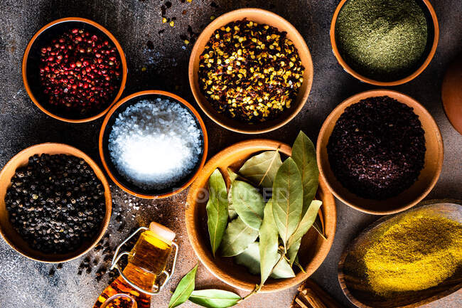 Spices and herbs on wooden background — Stock Photo