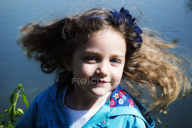 Portrait of a smiling girl spinning around with flowing hair, Italy — Stock Photo